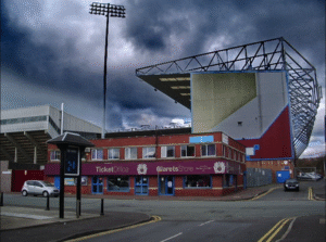 Turf Moor under the rain — the setting Pep Guardiola jokingly told Messi to avoid.