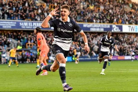 Ivanovic celebrating a goal for Millwall - "The Serbian striker's 13-goal season has Premier League clubs circling